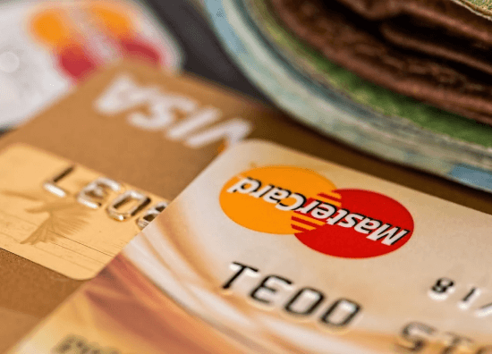 Mastercard and visa on table