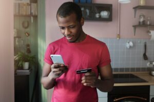 person holding smartphone making payment