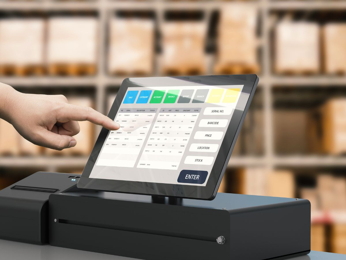 person tapping POS system