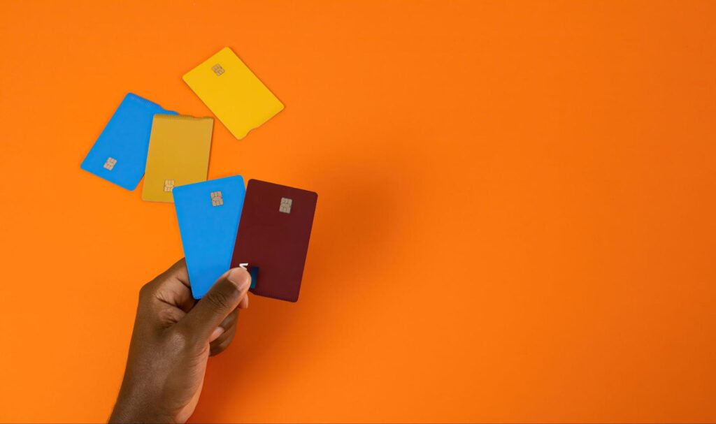 aerial view of credit cards on orange background 